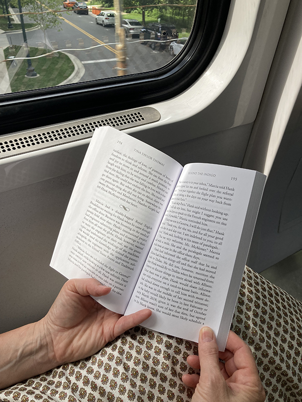 Woman reading on metro